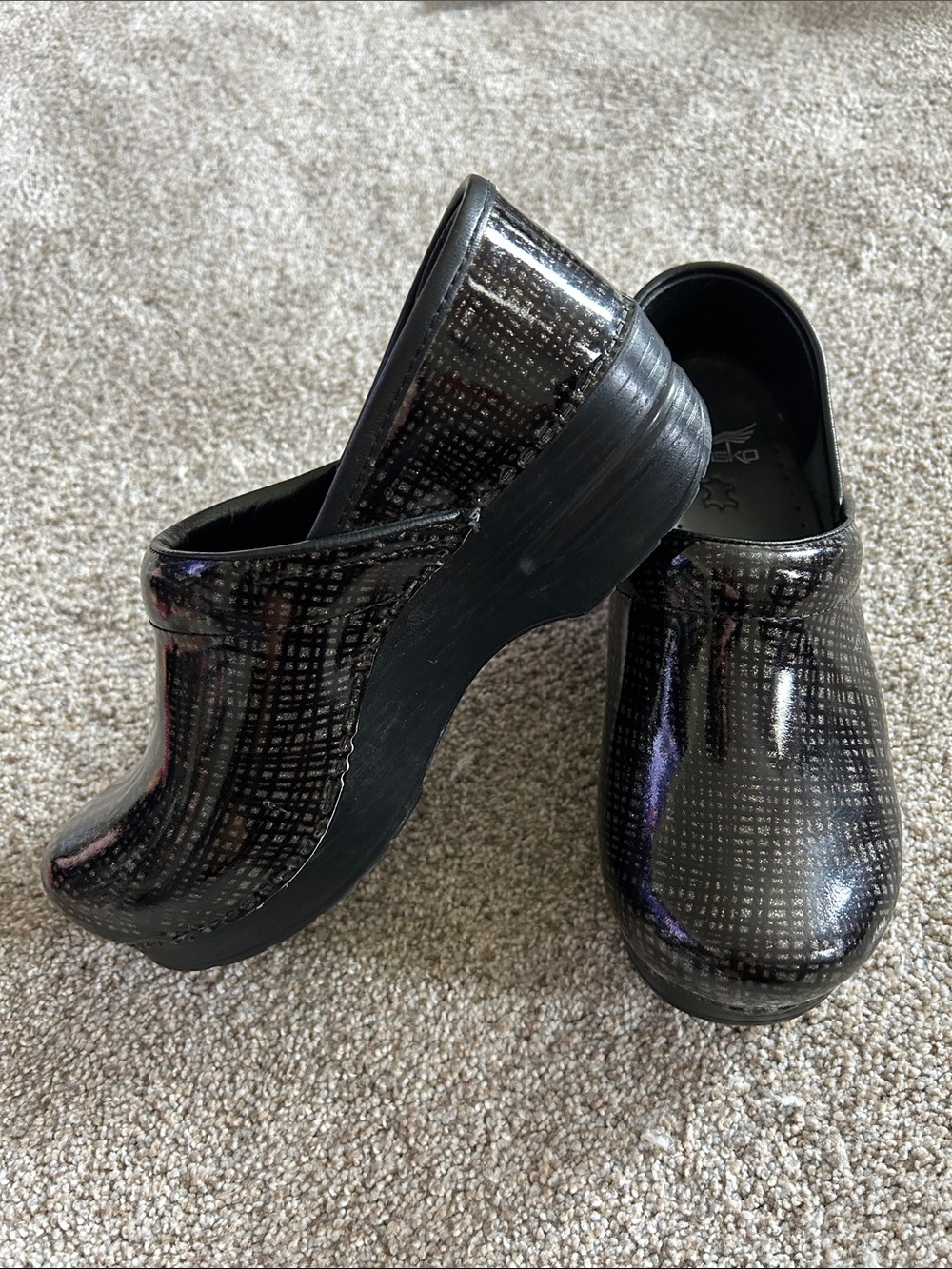 Dansko Black Patent Clogs with Subtle Grid Sheen